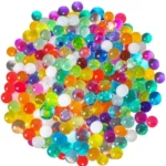 Πολύχρωμες Flower Gel Balls υδρογέλης σε γυάλινο βάζο με φυτό